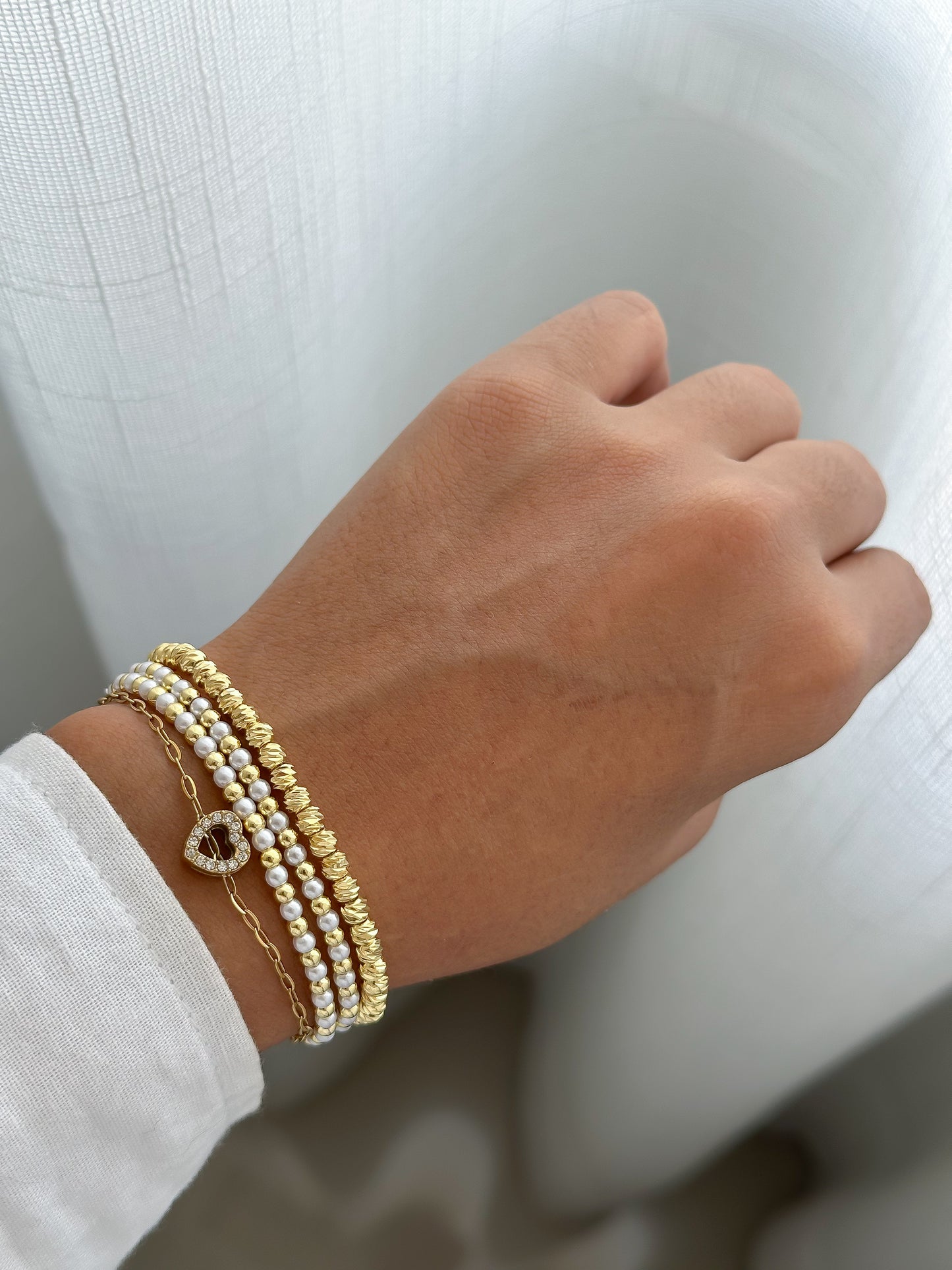 Pulsera regulable mini perlas y doraod C/u