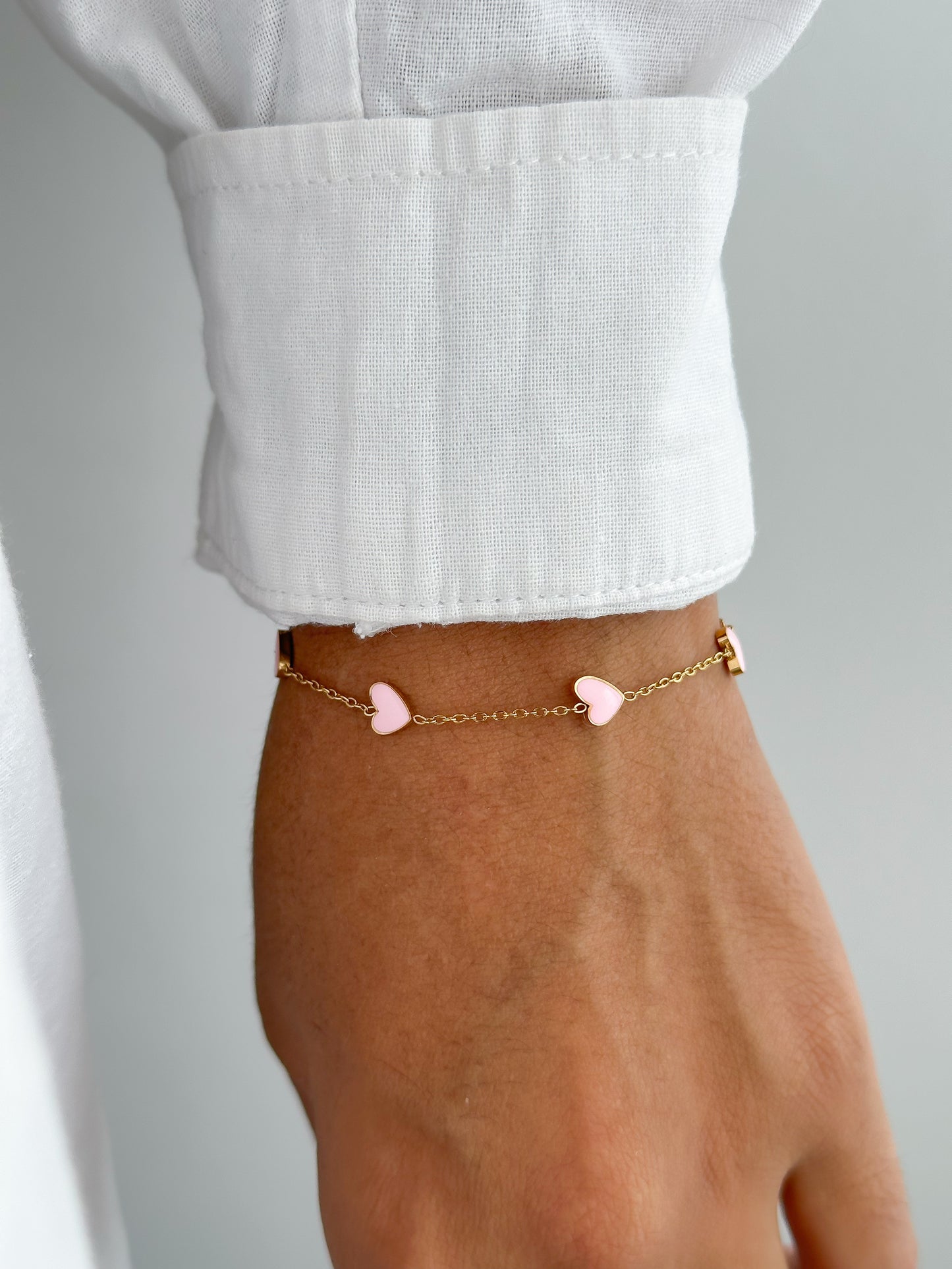 Pulsera corazones rosados