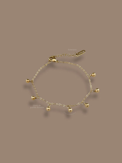 Pulsera lluvia de puntos dorados