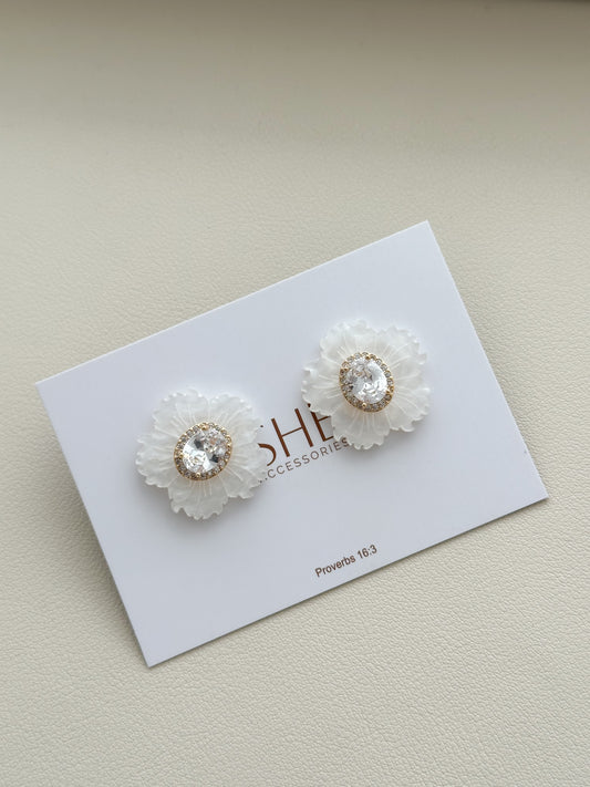 aretes flor punto de luz ovalado