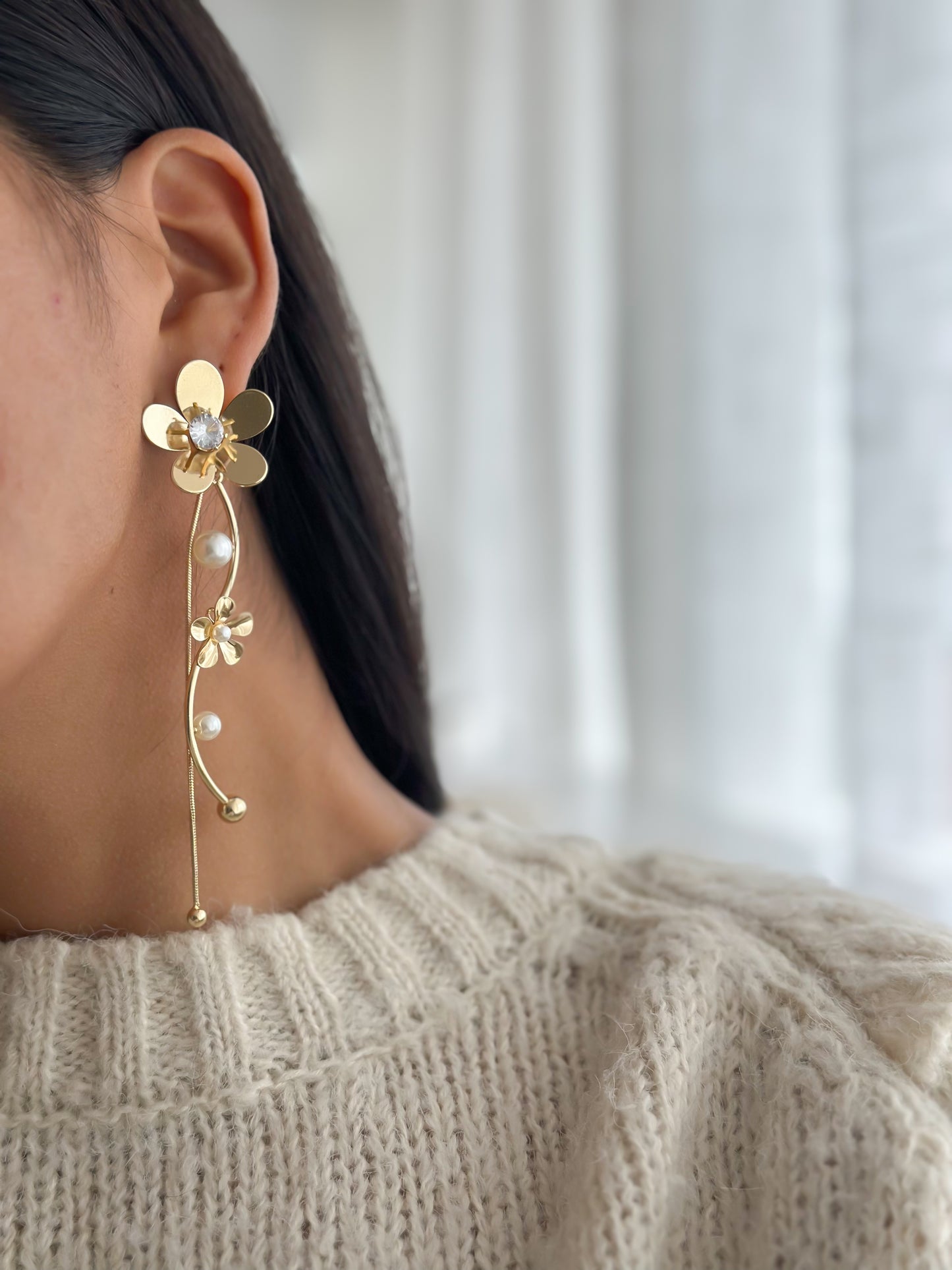 aretes flor mitad
