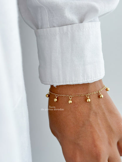 Pulsera lluvia de puntos dorados