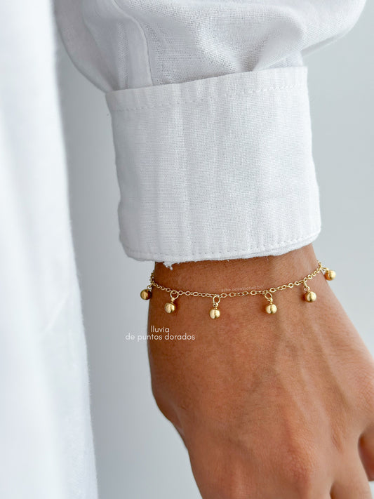 Pulsera lluvia de puntos dorados